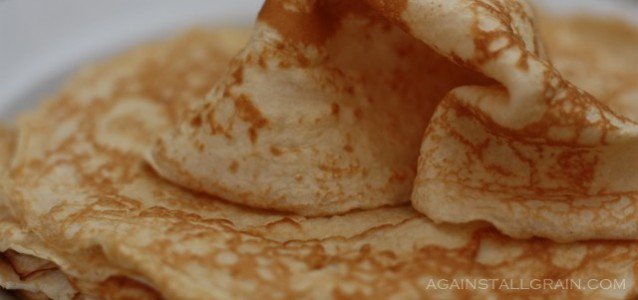 gluten free tortillas folded up on a plate ready to be added to another dish