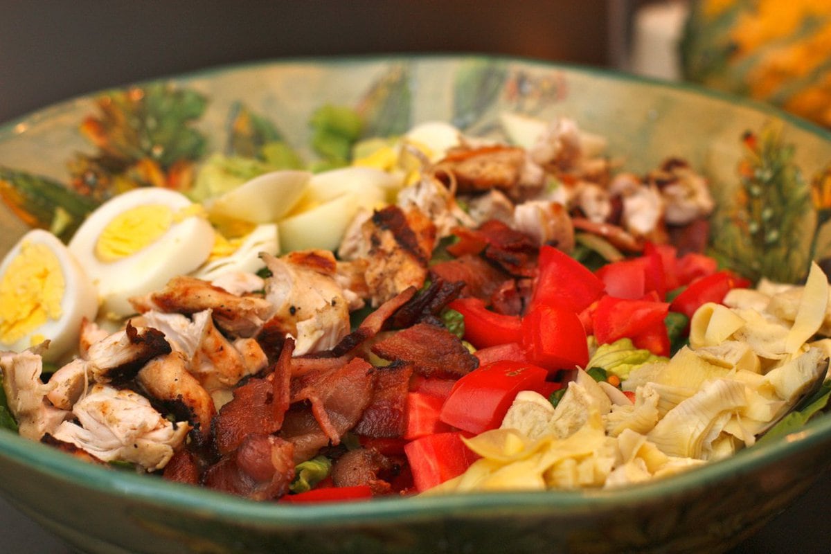 A bowl of Cobb Salad with Basil Vinaigrette.
