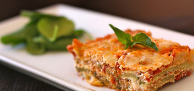 A serving of Grain-Free Lasagna is made with "breaded" zucchini and dry curd cottage cheese to mimic ricotta.