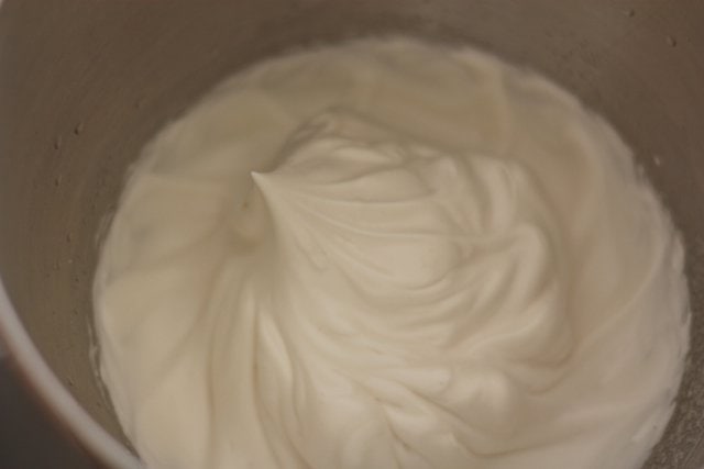 prepped meringue mixture showing stiff peaks