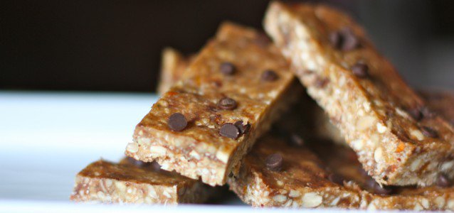 A plate full of dark chocolate peanut butter energy bars.