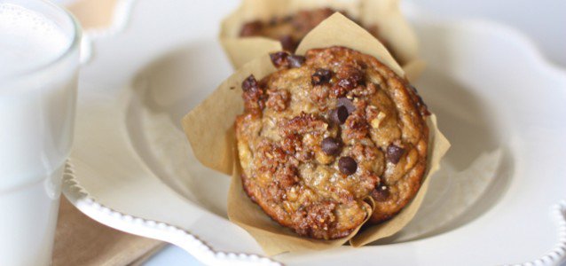 healthy banana muffins wrapped in parchment paper and on a plate