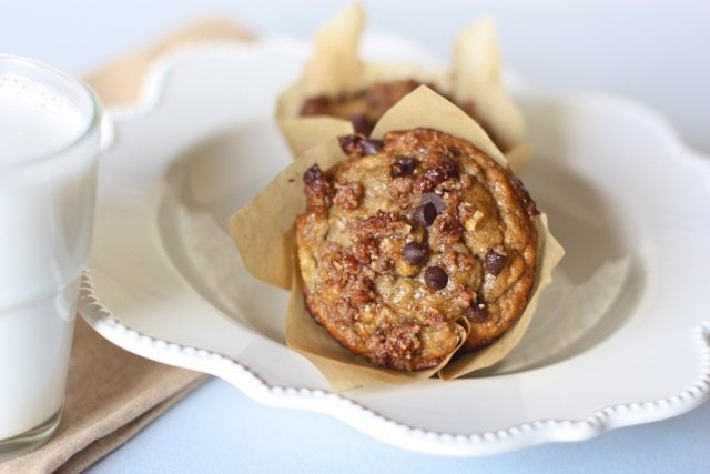 healthy banana muffins wrapped in parchment paper and on a plate