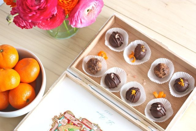 A box of beautifully decorated Dark Chocolate Pink Salt Truffles and Cappuccino Truffles .