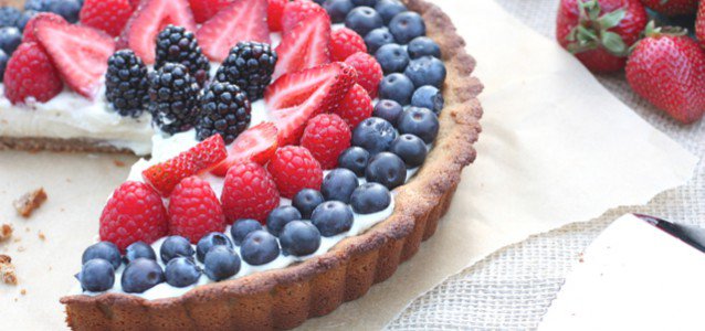 Delicious and sweet red, white and blue berry tart with dairy free vanilla bean custard.