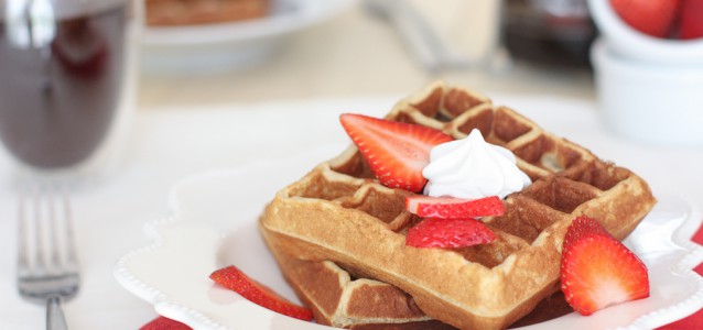 Grain Free Waffles topped with strawberries and cream.