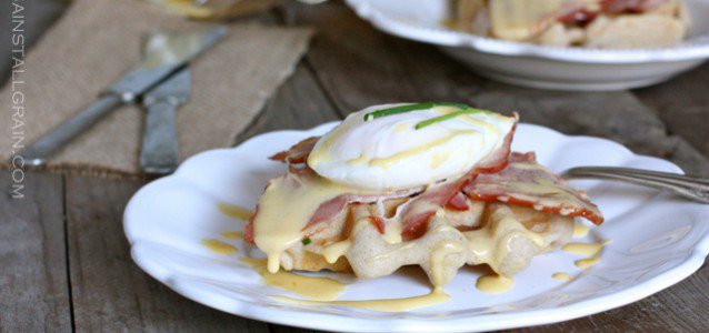 A plate of Eggs Benedict Over Savory Waffles.