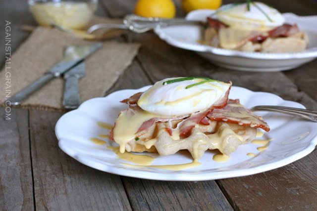 A plate of Eggs Benedict Over Savory Waffles.