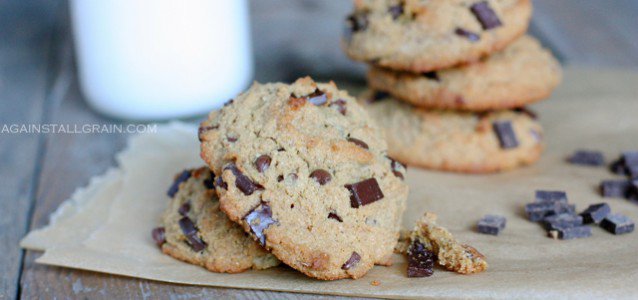 Nut Free 'Peanut' Butter Chocolate Chip Cookies piled high with a glass of milk.