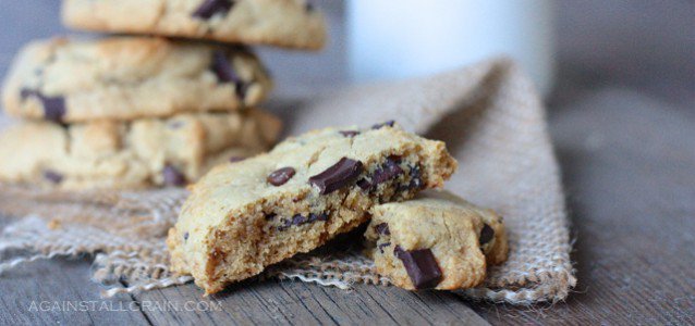 real deal chocolate chip cookies on a board over a napkin