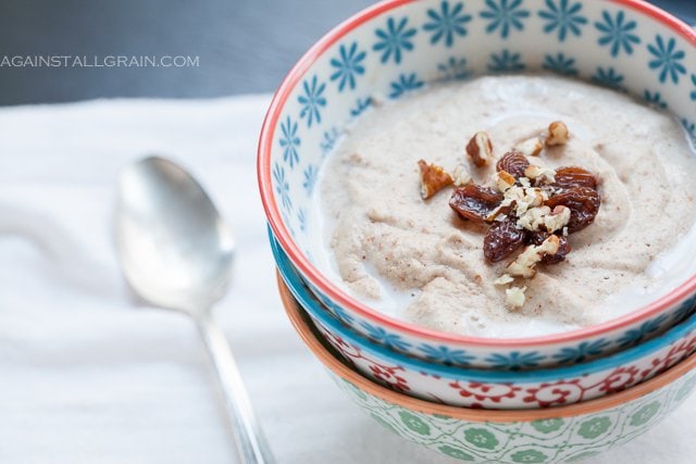 banana nut porridge in a decorative bowl with walnuts on top