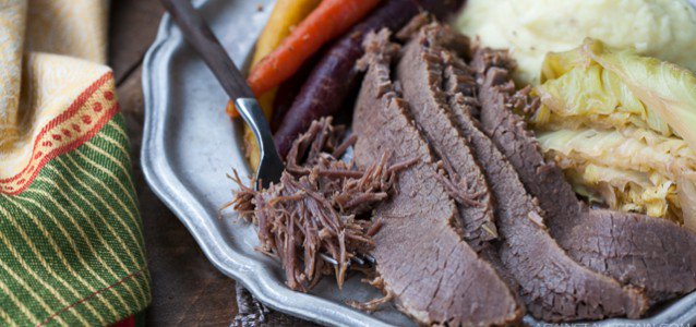 A plate of Corned Beef and Cabbage with Parsnip Turnip Purée .