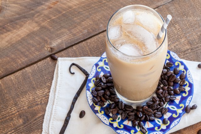 Refreshing glass of vanilla bean iced latte.