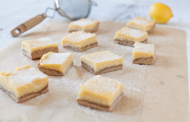 Lucious lemon bars dusted with powdered sugar with just the right amount of tang and sweetness!