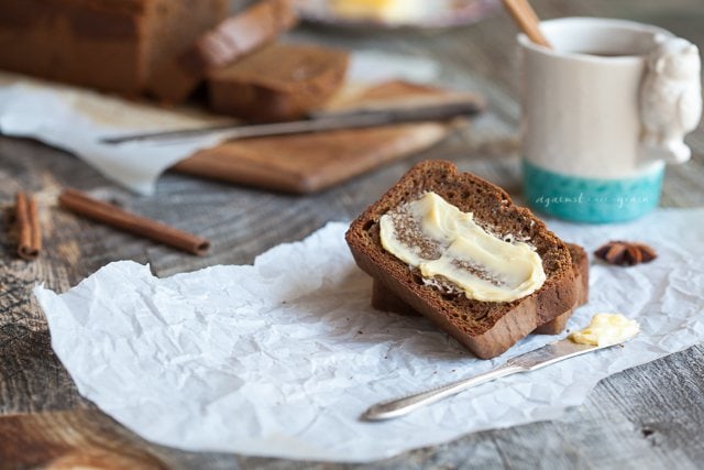 gluten free pumpkin bread on a napkin with dairy free butter on top