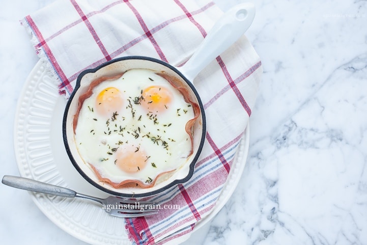 A ramekin of shirred eggs, gluten free, whole 30 and keto friendly.