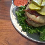ground short rib and brisket burger w grilled onions & pickles