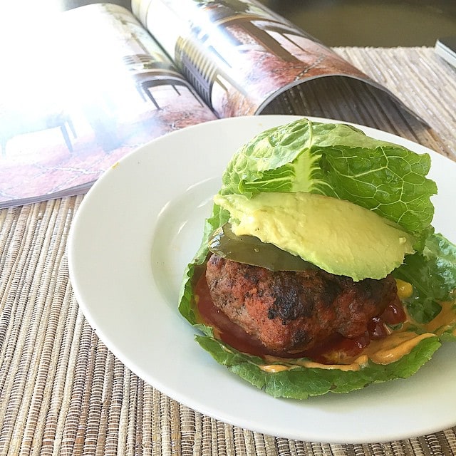 eating_an_awesome_lettuce_wrapped_burger_with_chipotle_mayo__mustard__ketchup__tomato__avocado__and_pickle_over_the_new_drool-worthy__anthropologie_house_and_home_catalog._I_want_every_single_in_there.__aageats__anthropologie__Paleo__grainfree