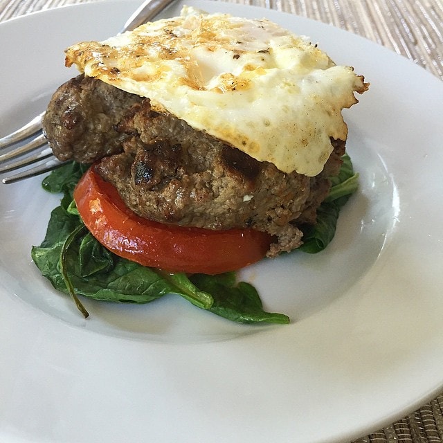 Breakfast._Leftover_burgers__with_saut_ed_spinach_and_a_grilled_tomato_and_an_egg_on_top.__aageats__paleo__breakfast