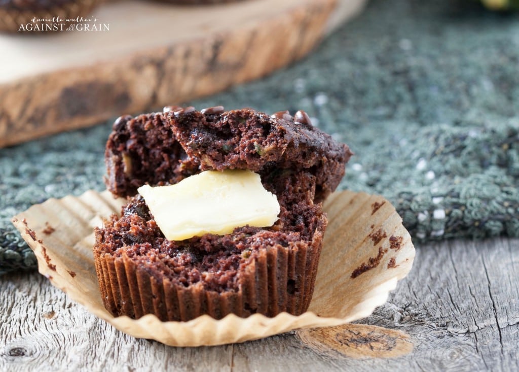 moist chocolate zucchini muffin with a dollop of butter