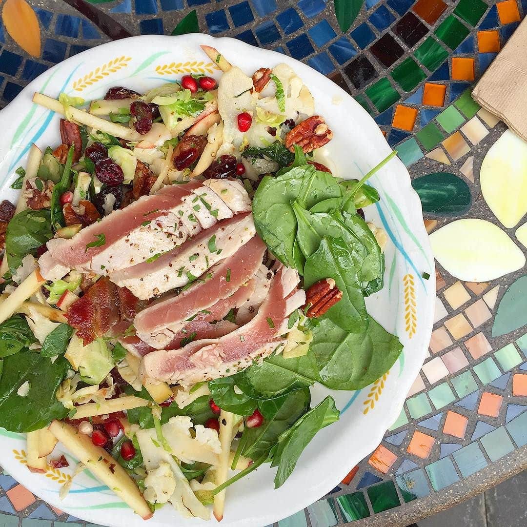 Lunch._Warm_spinach_salad_with_saut_ed_cauliflower__brussels_sprouts__apples__bacon__pomegranate_seeds__and_I_added_all_the_tuna_to_the_top__danielleeats