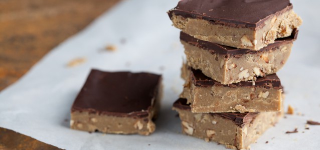 no-bake sunflower butter chocolate crunch bars on a table with parchment paper