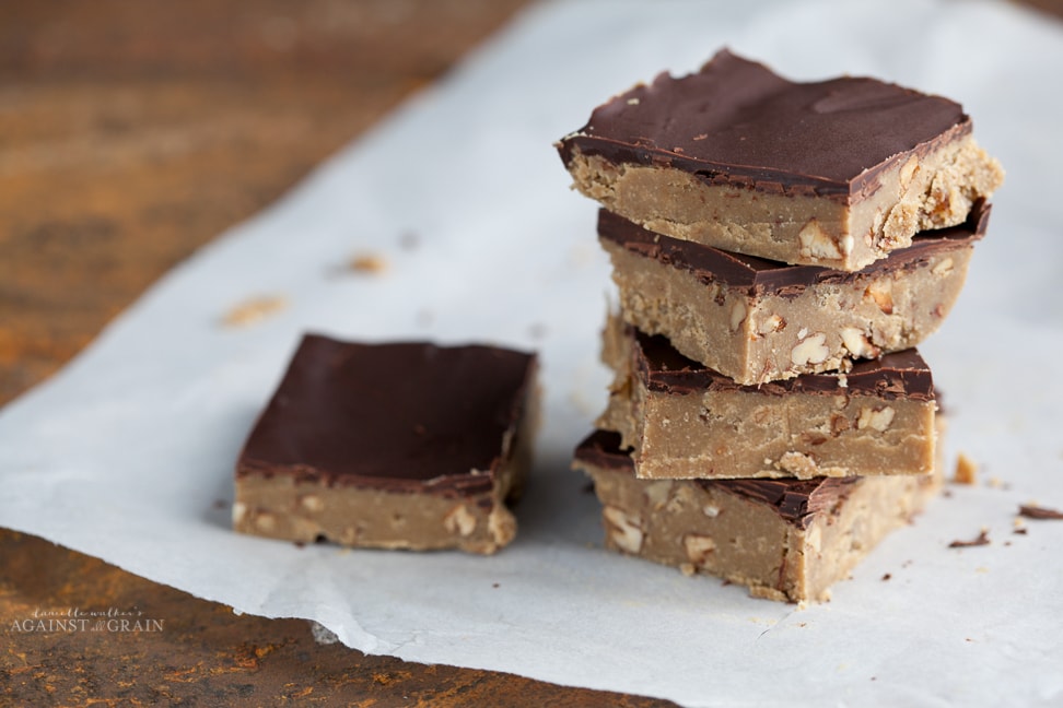 no-bake sunflower butter chocolate crunch bars on a table with parchment paper