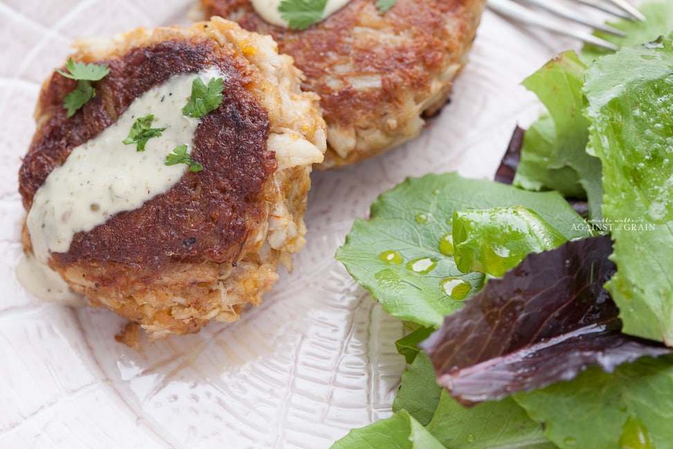 Crab cakes look delicious topped with remoulade sauce.