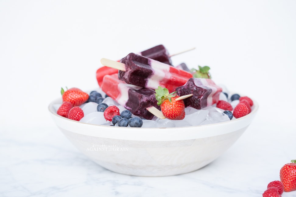 A bowl of icy paleo Firecracker Popsicles made with wholesome ingredients!