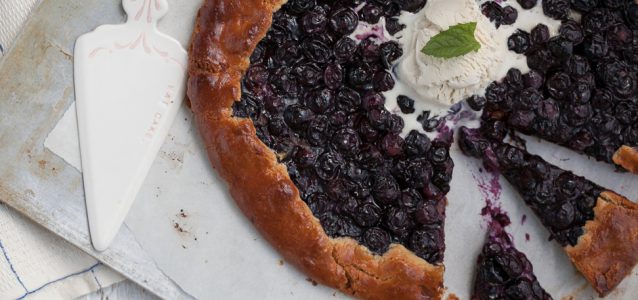 Buttery and flaky gluten free blueberry galette topped with ice cream or non dairy whipped topping!