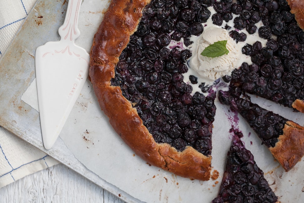 Buttery and flaky gluten free blueberry galette topped with ice cream or non dairy whipped topping!