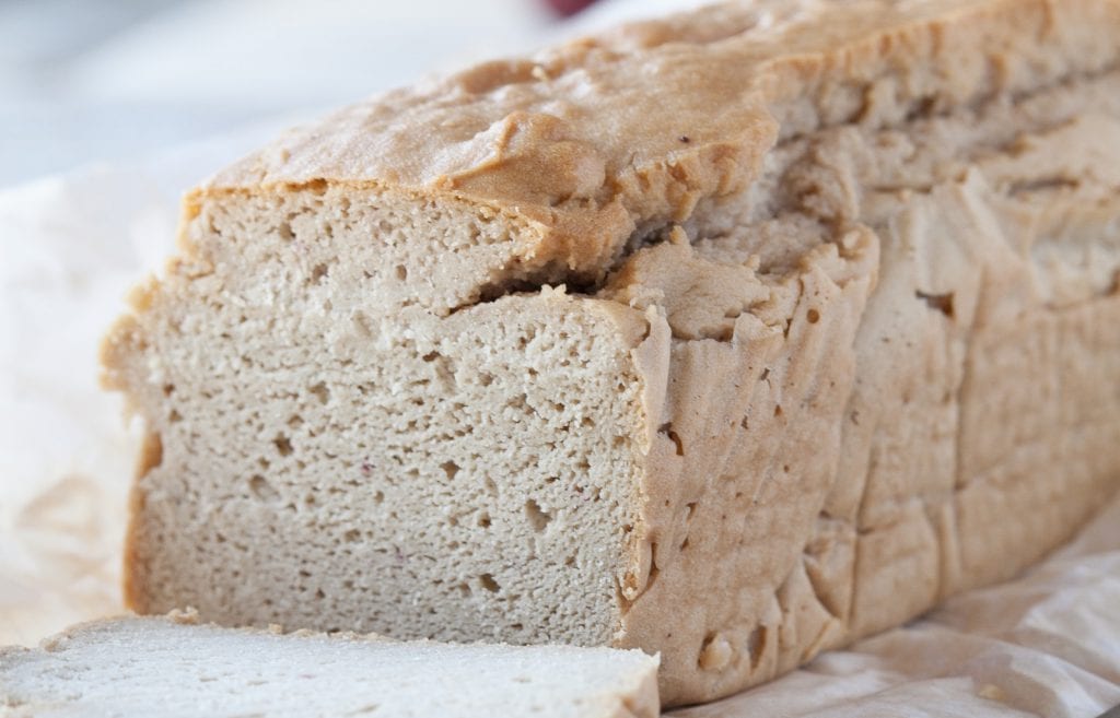 Loaf of grain free blender bread cut showing the delicious inside