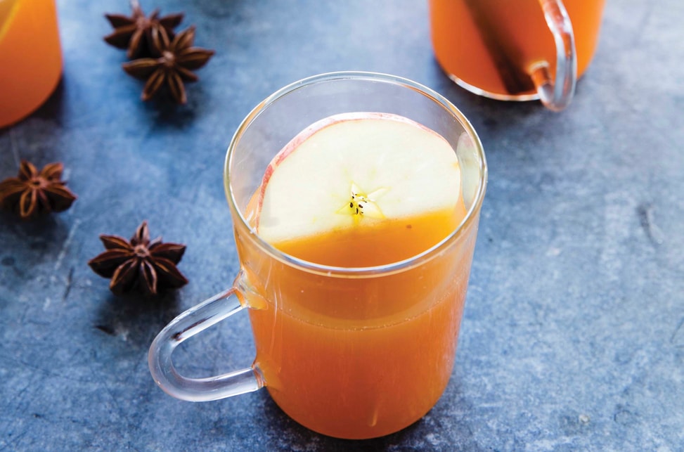 A piping hot cup of mulled apple cider.