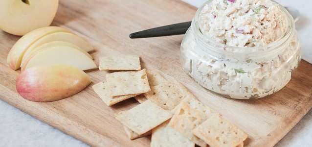 A jar of the best tuna salad (scd and whole30 approved) served with apples and crackers.