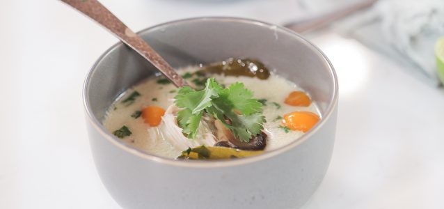 Creamy Thai coconut soup steaming in a bowl.