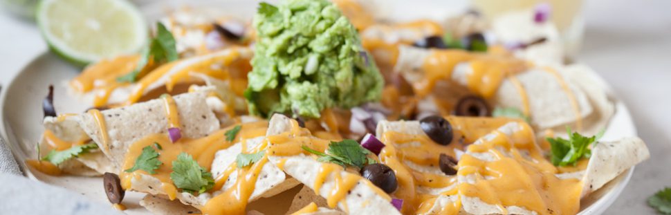 Paleo Nacho Cheese on a plate of tortilla chips