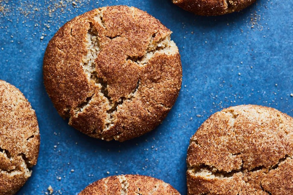 Gluten Free Snickerdoodle Cookies that are moist on a blue background.