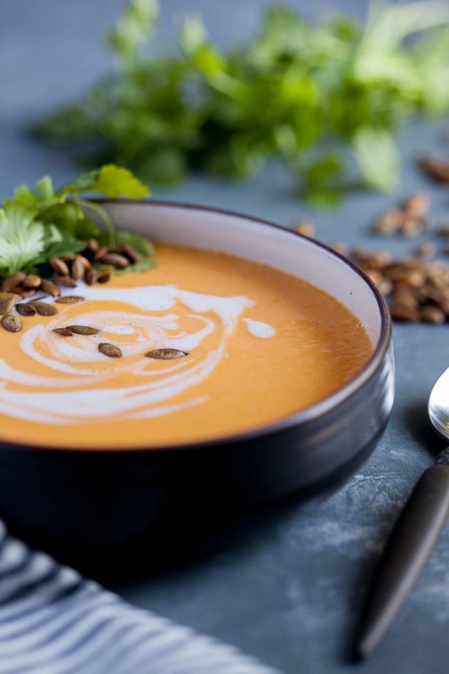 Red Curry Butternut Squash Soup in a black bowl