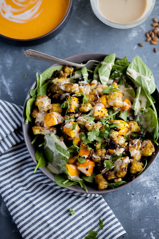 Curry Roasted Cauliflower and Mango Salad in a gray bowl on a gray marbled table