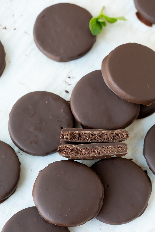 Chocolate covered cookies on a white surface