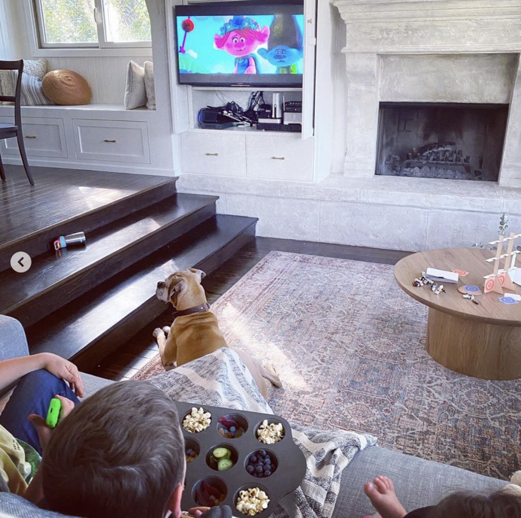 children watching cartoon movie in home living room