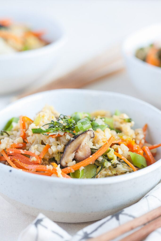 white bowl containing a serving of veggie fried rice 