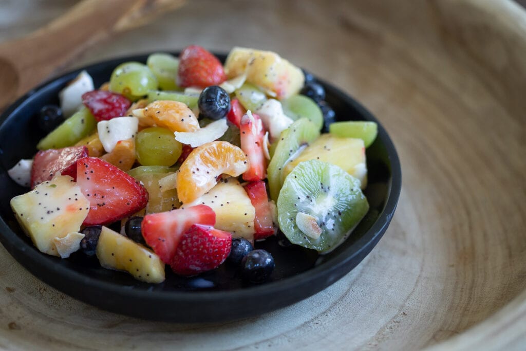 Dairy free fruit salad served in a black bowl