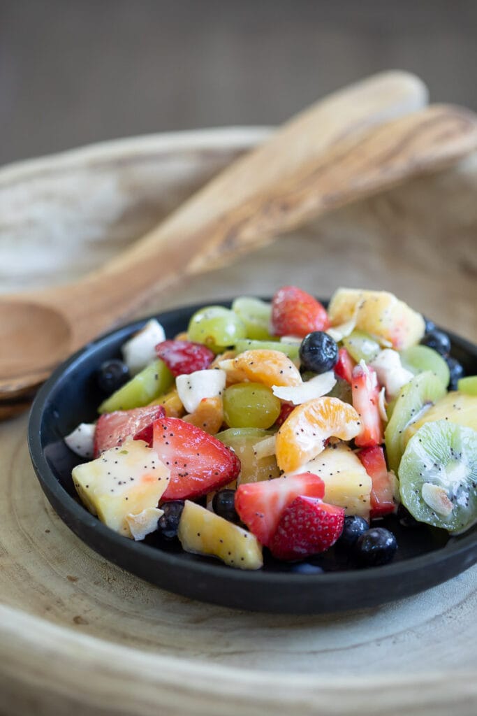 dairy free fruit salad served in a black bowl