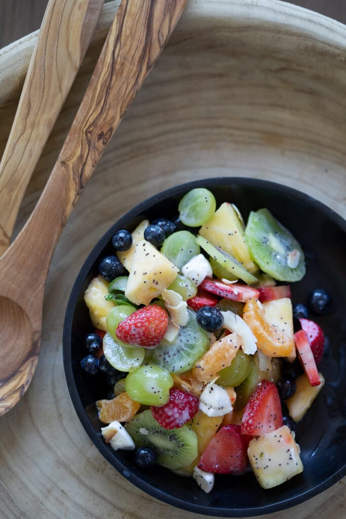 dairy free fruit salad served in a black bowl