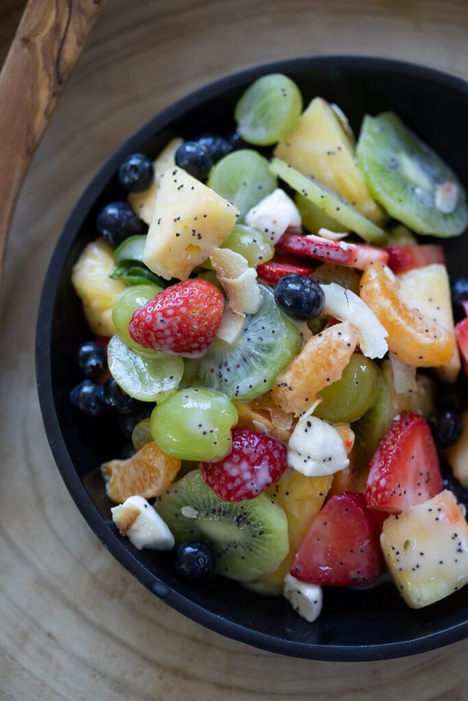 dairy free fruit salad served in a black bowl