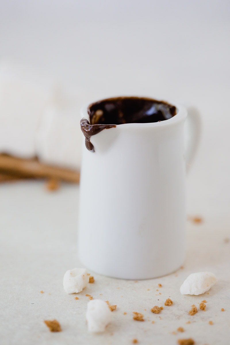 small white saucer containing chocolate fudge